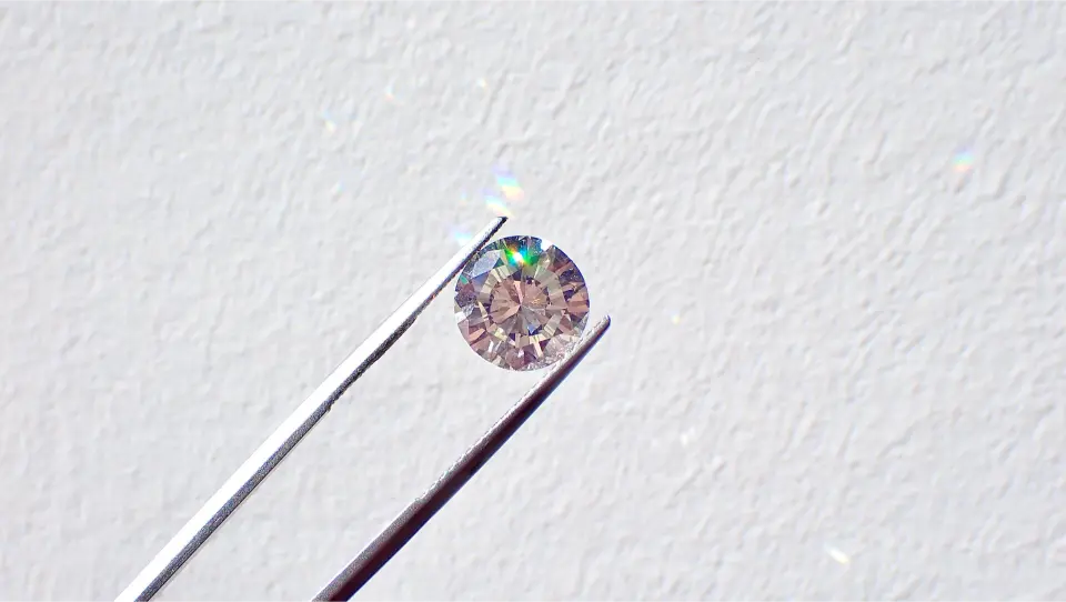 diamond held in tweezer