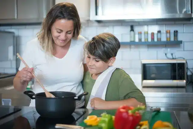 mom cooking with his son