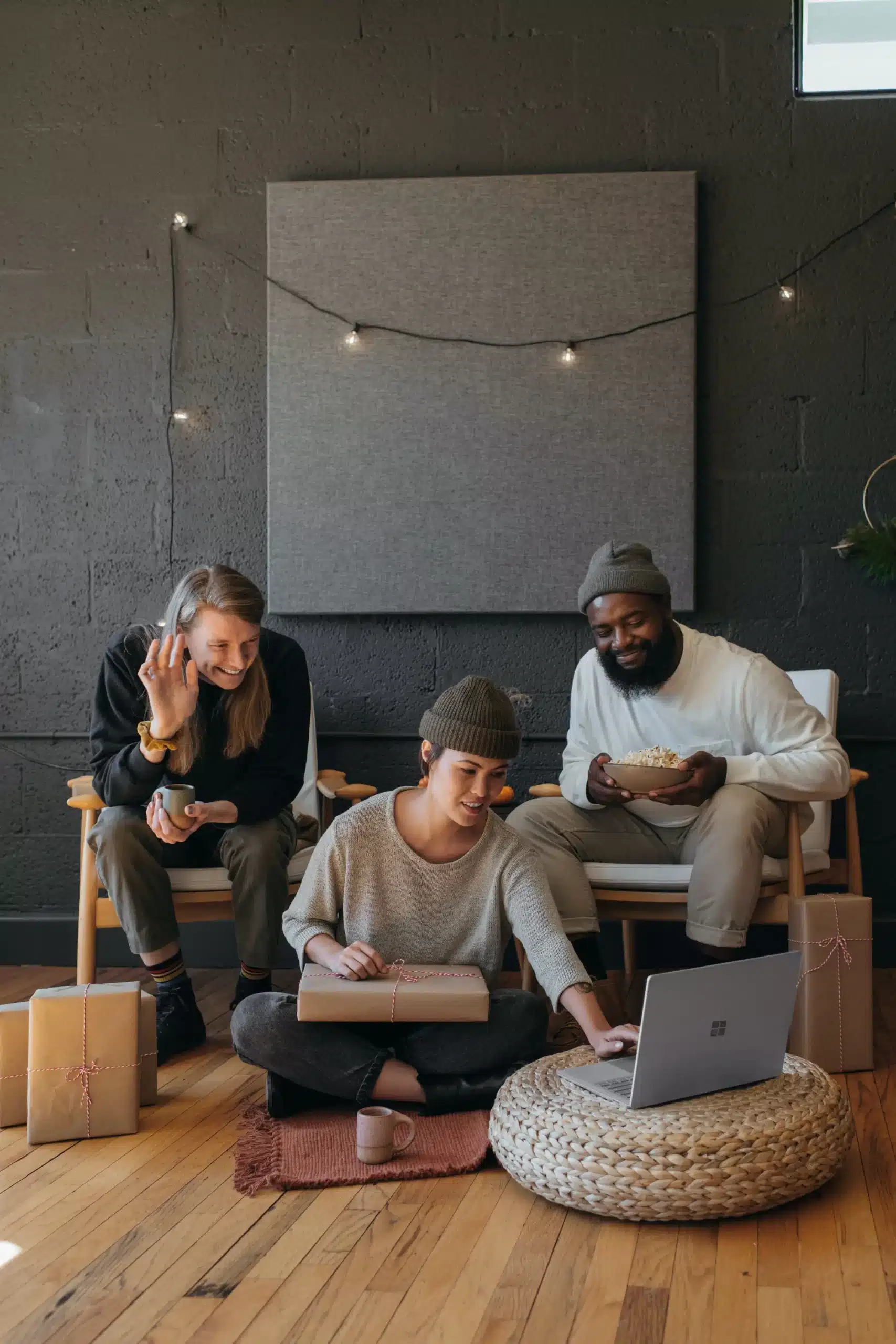 three people working on a computer